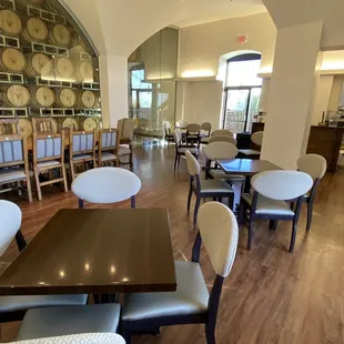 a dining room with tables and chairs