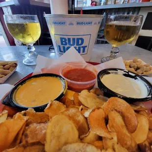 Chip Tray of homemade potato chips with a trio of dipping sauces is a great starter or snack with  drinks.