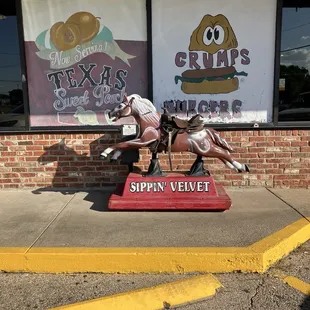 Grumps sign and horse