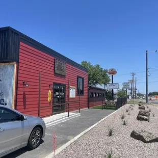 a car parked in front of a restaurant