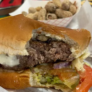 The perfect mushroom, swiss burger. Mayo, mustard, lettuce, pickles &amp; tomatoes. Delicious, all you can eat peanuts!