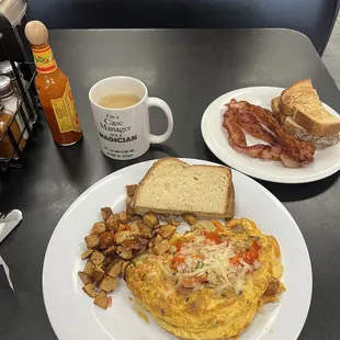 Omelette with a side of bacon and toast