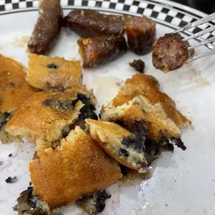 rubbery, hard sausage. Microwaved, perhaps?