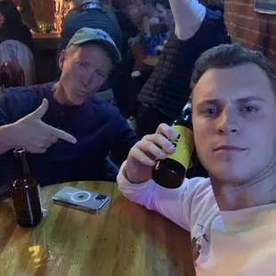 two men sitting at a table