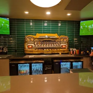 The bar is pretty awesome, featuring a Chevy front end converted into a beer tap.