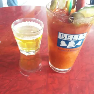 a bloody drink and a glass of beer