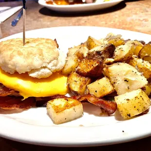 Egg sandwich with bacon on biscuit - disappointed - biscuit small and crumbled, bacon (and potatoes) not well done enough