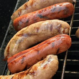 hot dogs on a grill