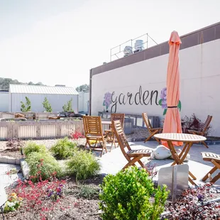 a patio with tables and chairs