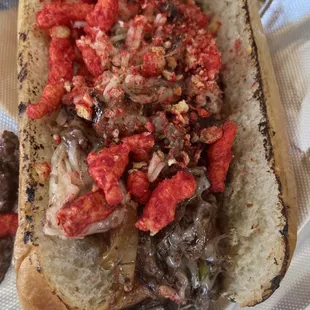 a hot dog with onions and tomatoes