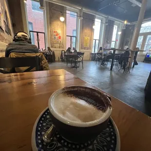 a cup of coffee on a saucer