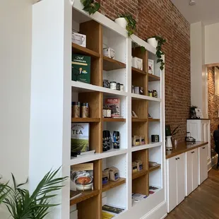 a brick wall and shelves