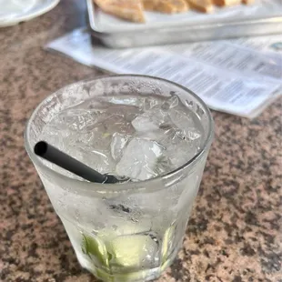 Tito&apos;s and soda and quesadilla