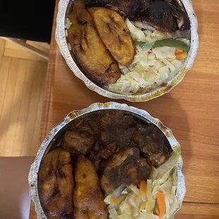 Oxtail platter and jerk chicken platter with steamed cabbage, rice and peas, and plantains
