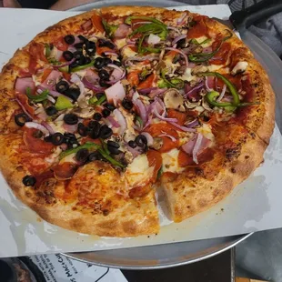 Super pizza, 8 slices, half black olives