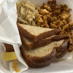Huevos con chorizo. Very tasty. With hash browns, toast, fruit stick.
