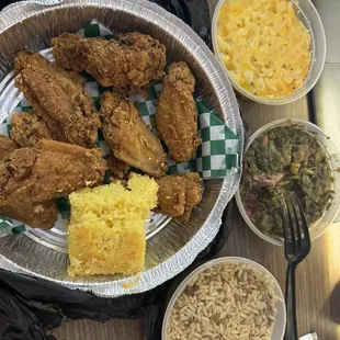 Chicken wings, collard greens, macaroni and cheese, dirty rice.