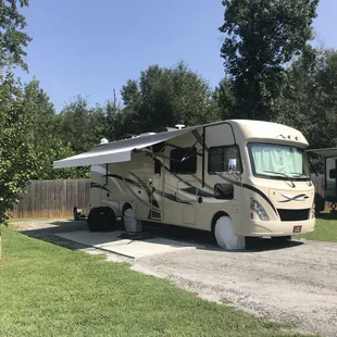 Gravel pads with grass &amp; paver patio.