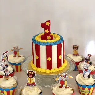 a birthday cake and cupcakes