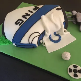 2 layer Chocolate Cake w/Vanilla Buttercream Filling and Frosting.  Fondant covered Golf bag, clubs and ball.