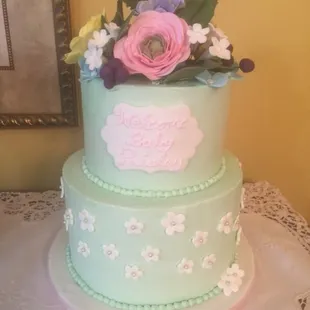 Yellow Cake w/fresh Raspberry Filling and Red Velvet Cake w/Cream Cheese Filling and Swiss Meringue Buttercream.  Handmade Sugar Flowers.