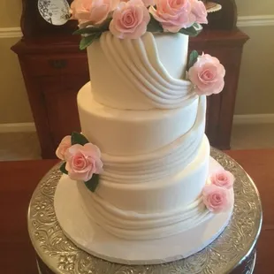 White Fondant Drapes and Handmade Sugar Roses.