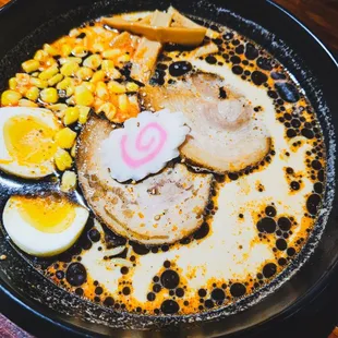 Spicy, chashu, egg, black garlic oil, corn, and bamboo shoots. Add an extra spicy miso paste because it&apos;s white people spicy. Lol