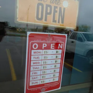 Hours of operation, front entry door.