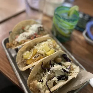 three tacos on a tray