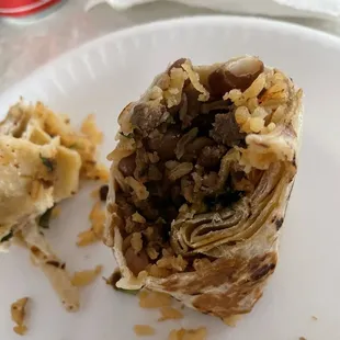 Half eaten Carna Asada Burrito