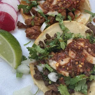 Carne asada and Pastor tacos.