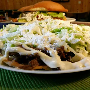 3 enchiladas filled with seasoned chicken or beef. Topped with melted Oaxaca cheese, avocado and chopped onions. Cover with green salsa, red