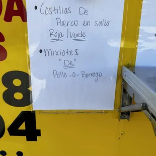 a sign on the side of a food truck