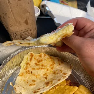 Quesadilla has all the cheese bundled up to one side, half the quesadilla is empty and the cheese isn&apos;t thoroughly melted....