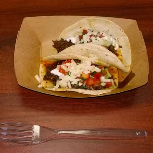 Judging from the diminutive size of their "Street Tacos" (2 / $5.00) these truck operators must be from an area with very small streets!