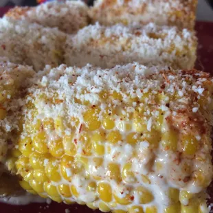 Traditional street corn with a healthy twist. Greek yogurt, cotija, and tajin slow roasted corn that taste just as good as from an elotera.