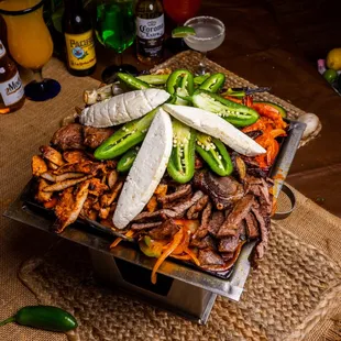 a platter of meat and vegetables