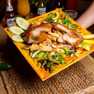 a person holding a plate of food