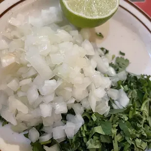 Onions, cilantro and limes for the Sopa de Albondigas