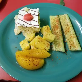 Fruits. Tres leche cake. Cucumbers.