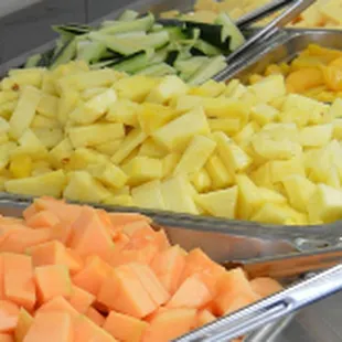 a variety of vegetables in trays