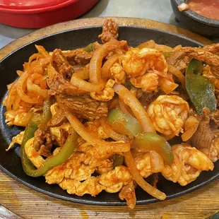 Chicken, steak, and shrimp fajitas