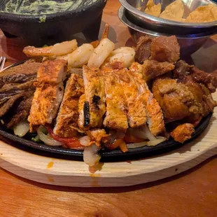 Fajita Sampler with Chicken, Steak, Shrimp and Carnitas...also came with four huge tortillas, beans, rice, guac, sour cream and guac.