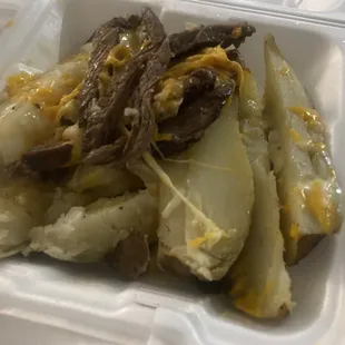 a close up of a meal in a styrofoam container