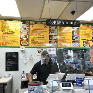 a man and a woman ordering food