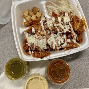 Chilaquiles breakfast plate with red sauce - 3 different salsas offered