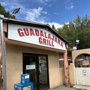 Front door with outside patio nearby