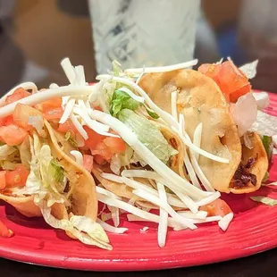 Happy hour chicken tacos and margarita.