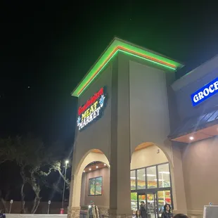 people walking in front of the building