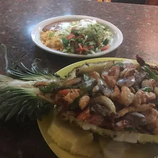 Fajitas Tropicales served in a sweet pineapple with chicken shrimp and beef for $12.99!!